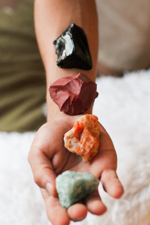 Hands holding crystal. Concept of occult symbolism and spiritual practice.の写真素材