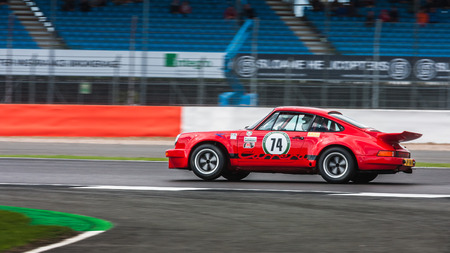 Silverstone, United Kingdom- July 30, A Porsche 911 Carrera RSR racing on the 2017 Silverstone Classic Eventのeditorial素材