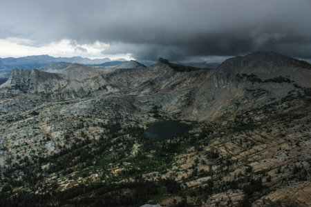 View from Cathedral Peak, the lightning rod of Yosemite National Park with a stunning view overlooking the landscape and a storm coming.の写真素材