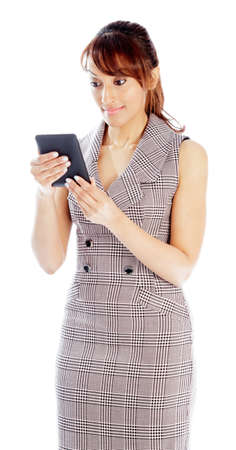 Indian business woman posing in studio isolated on a backgroundの写真素材