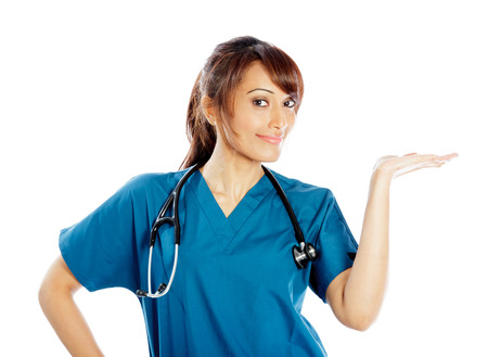 Attractive Indian doctor woman posing in a studio in front of a backgroundの写真素材