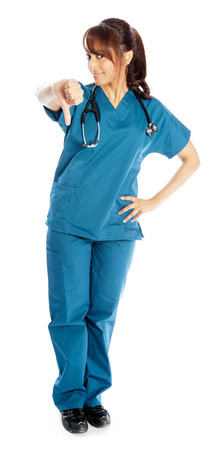 Attractive Indian doctor woman posing in a studio in front of a backgroundの写真素材