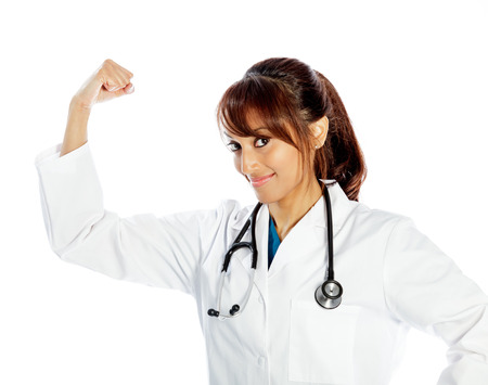Attractive Indian doctor woman posing in a studio in front of a backgroundの写真素材