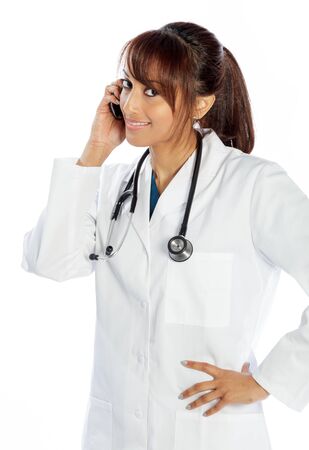Attractive Indian doctor woman posing in a studio in front of a backgroundの写真素材