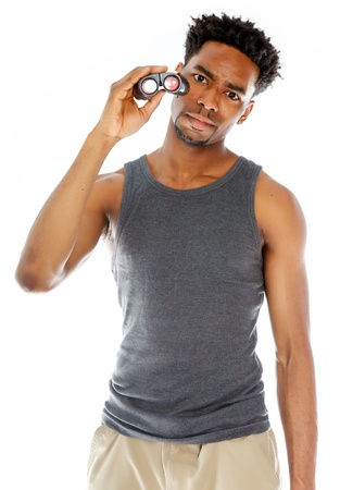 Attractive afro-american man posing in a  studio isolated on a backgroundの写真素材