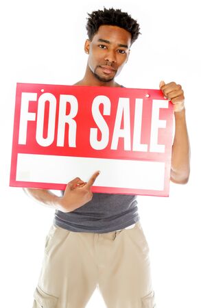 Attractive afro-american man posing in a  studio isolated on a backgroundの写真素材