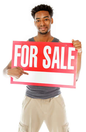 Attractive afro-american man posing in a  studio isolated on a backgroundの写真素材