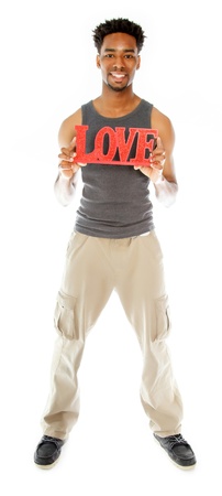 Attractive afro-american man posing in a  studio isolated on a backgroundの写真素材