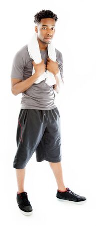 Attractive afro-american man posing in a  studio isolated on a backgroundの写真素材