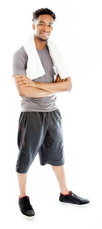 Attractive afro-american man posing in a  studio isolated on a backgroundの写真素材