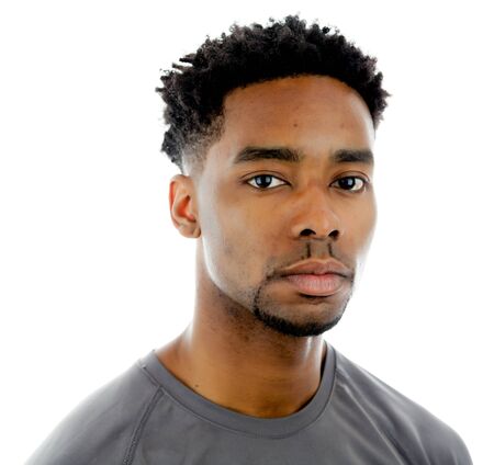 Attractive afro-american man posing in a  studio isolated on a backgroundの写真素材