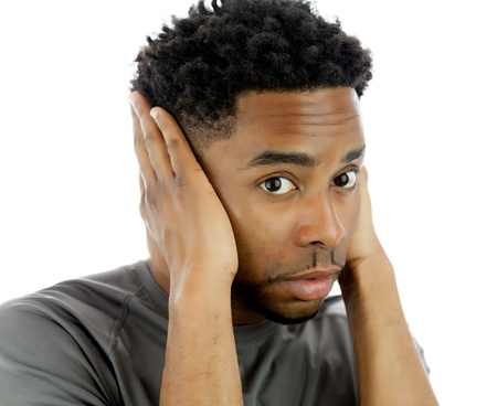 Attractive afro-american man posing in a  studio isolated on a backgroundの写真素材