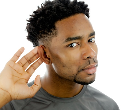 Attractive afro-american man posing in a  studio isolated on a backgroundの写真素材