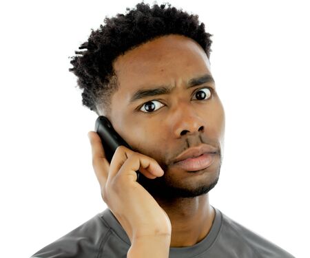 Attractive afro-american man posing in a  studio isolated on a backgroundの写真素材