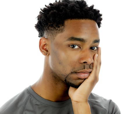 Attractive afro-american man posing in a  studio isolated on a backgroundの写真素材
