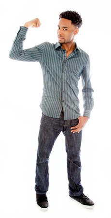 Attractive afro-american man posing in a  studio isolated on a backgroundの写真素材