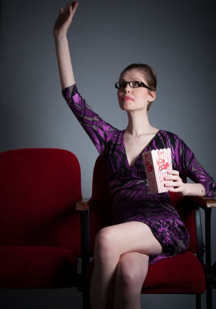 Attractive caucasian woman in the theatre in her 30 isolated on a grey backgroundの写真素材