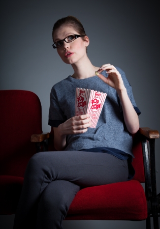 Attractive caucasian woman in the theatre in her 30 isolated on a grey backgroundの写真素材