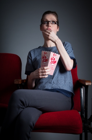 Attractive caucasian woman in the theatre in her 30 isolated on a grey backgroundの写真素材