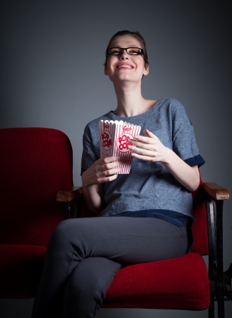 Attractive caucasian woman in the theatre in her 30 isolated on a grey backgroundの写真素材