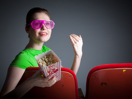 Attractive caucasian woman in the theatre in her 30 isolated on a grey backgroundの写真素材