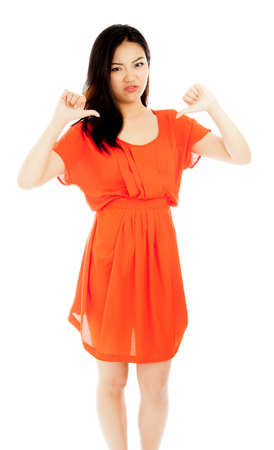 Attractive asian girl in her twenties isolated on a plein background shot in a studioの写真素材