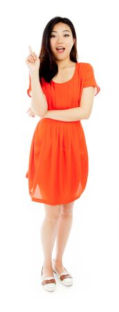 Attractive asian girl in her twenties isolated on a plein background shot in a studioの写真素材