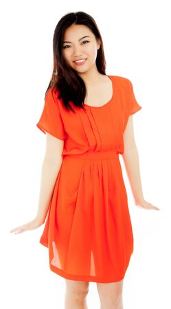 Attractive asian girl in her twenties isolated on a plein background shot in a studioの写真素材