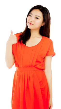 Attractive asian girl in her twenties isolated on a plein background shot in a studioの写真素材