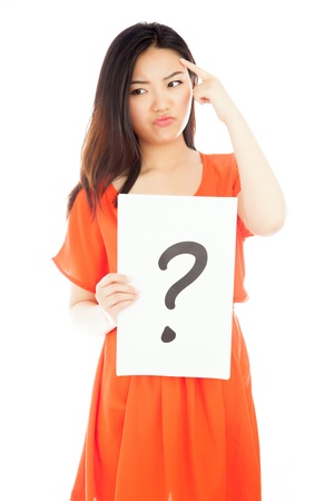 Attractive asian girl in her twenties isolated on a plein background shot in a studioの写真素材