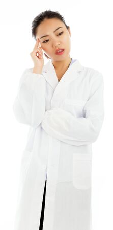 Attractive asian girl in her twenties isolated on a plein background shot in a studioの写真素材