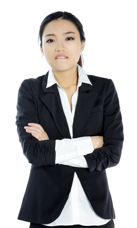Attractive asian girl in her twenties isolated on a plein background shot in a studioの写真素材