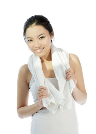 Attractive asian girl in her twenties isolated on a plein background shot in a studioの写真素材