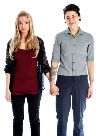Cute Lesbian couple 30 years old shot in studio isolated on a white backgroundの写真素材