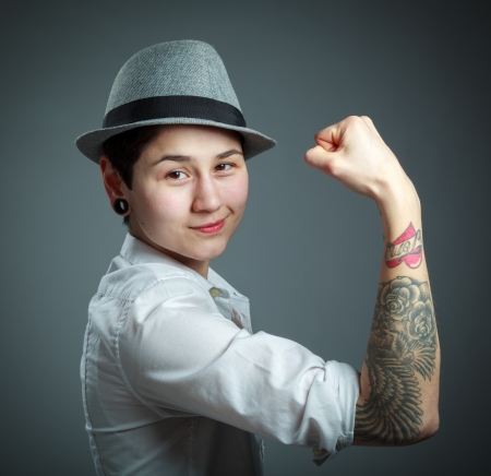 Attractive caucasian blond girl isolated on a grey backgroundの写真素材