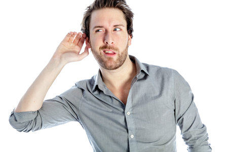 Attractive 30 years old caucasion man shot in studio isolated on a white background