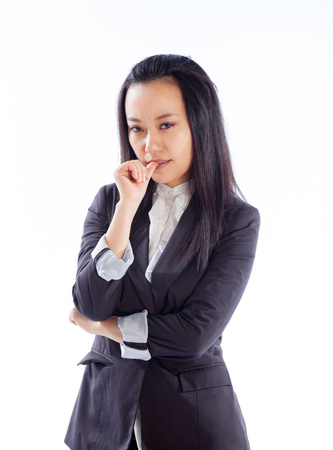 Attractive asian girl in her 30s shot in studio isolated on a white backgroundの写真素材