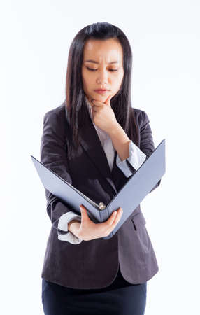 Attractive asian girl in her 30s shot in studio isolated on a white backgroundの写真素材