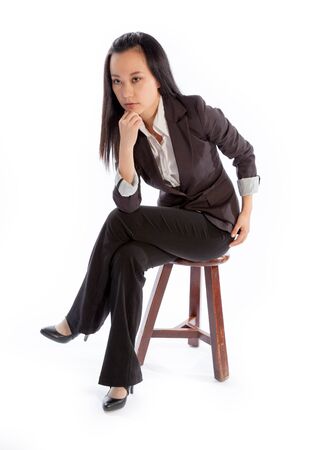 Attractive asian girl in her 30s shot in studio isolated on a white backgroundの写真素材