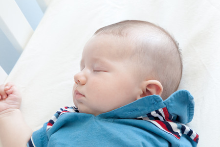 Close-up of a baby boy sleepingの写真素材