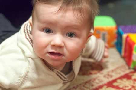 Close-up of a baby boy playing