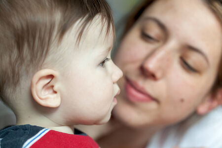 Close-up of a woman kissing her sonの写真素材