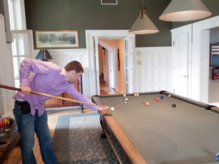 Young man playing pool