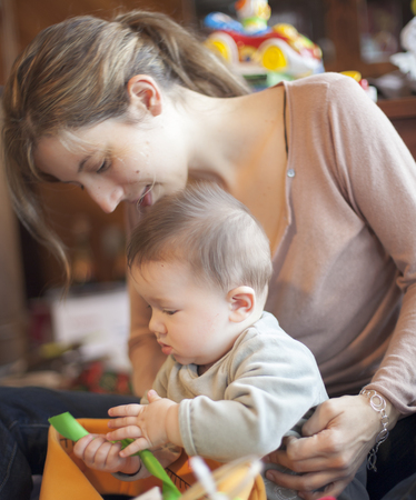 Woman playing with her baby boyの写真素材