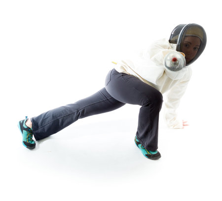 Female fencer practicing her fencing technique