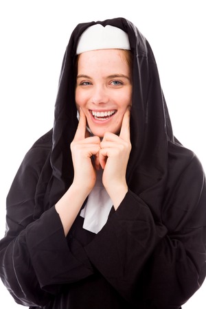 Young nun showing smiley faceの写真素材