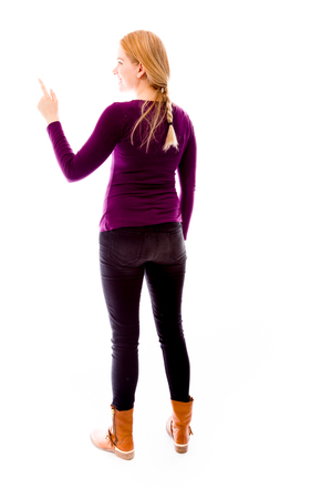 Rear view of a young woman using imagery virtual screenの写真素材