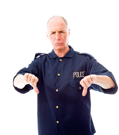 Policeman making thumbs down gestureの写真素材