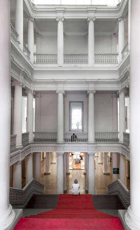 Rear view of a woman sitting on staircase, Peru 2011-06-19 11:39:45 AMのeditorial素材
