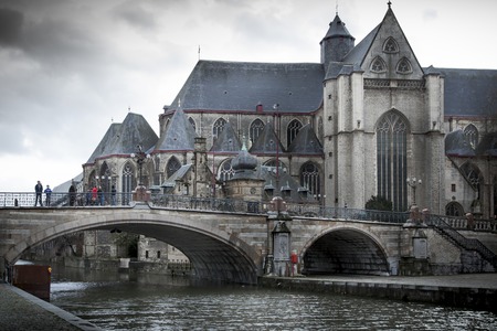 Church at waterfront, St Michael's Church, Saint Michael's Bridge, River Lys, Ghent, Belgium 2011-12-29 9:31:18 AMのeditorial素材
